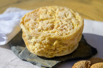 Tasting of local portuguese matured cheese queijo serpa,  Setubal area, Portugal