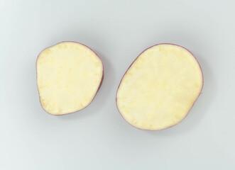 sliceds sweet potato slices over white background top view. fresh vegetable. 