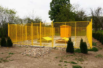 ground with tanks for liquefied gas. Modern gas installation with protective fencing. Yellow fence....
