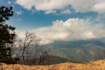 Fototapeta na wymiar Cloudscape over the mountains of Kings Canyon National Park, California, USA