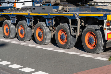 Wheels of a multi-axle car trailer for transporting large loads.