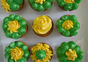 homemade yellow and green colored cupcakes