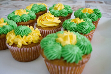 homemade yellow and green colored cupcakes