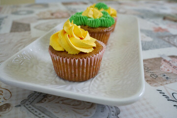 homemade yellow and green colored cupcakes
