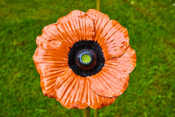 Beautiful garden decoration, a flower replica made of ceramic, (a apricot poppy replica).