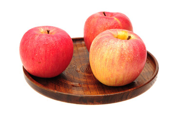 red apples on a wooden table