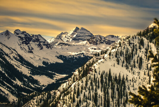 Gorgeous view of Colorado Mountain range at sunset; Maroon Bells peaks in background