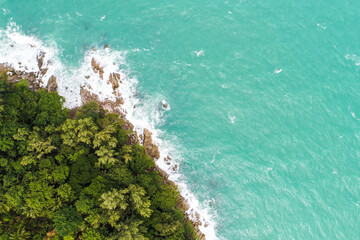 Aerial view green tree forest on sea island with sea wave beach