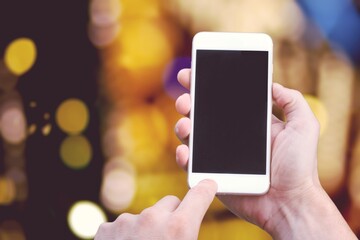 Hand hold a smartphone with a blank screen