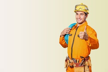 Happy young male electrical technician ready to work