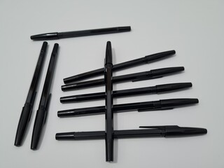 The office equipment used for writing is a black pen