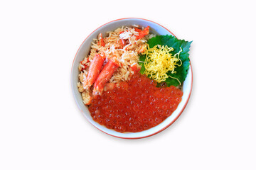 Bowl of rice topped with red king crab meat and Salmon roe on white background, isolate, top view