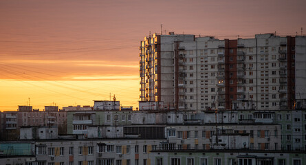 Sunlit multi-storey residential buildings in the residential area of Yasenevo in the south of the Russian capital at dawn.