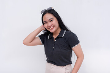 A friendly Filipino woman with strong long hair in her early 20s. Wearing a black polo shirt. Isolated on a white background.