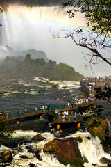 Tourists walk the platforms of the Iguazu Falls on the Brazilian side
