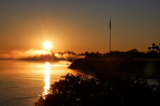 Sun rising and morning fog in Cape Canaveral. Sunrise. Digitally enhanced. Elements of this image furnished by NASA.