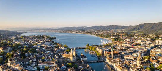 Aerial drone shot flying above Lake Zurich, Switzerland in sunny day.