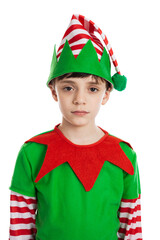 Portrait of an adorable 10 year old boy dressed in a Christmas elf costume with serious expression isolated on a white background - 550181218