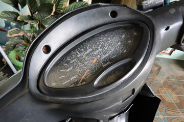 old speedometer of a motorcycle, Colored dashboard of a sport bike, top view. 