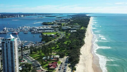 Flying slowly past luxury high rises at Gold Coasts Main Beach. The Beautiful Spit and Broadwater of Queenslands jewel.