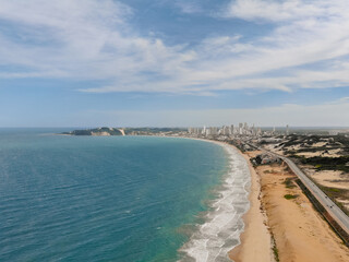 Fototapeta na wymiar View from Morro do Careca and Via Costeira, located at the southern of Ponta Negra Beach, in Natal, Rio Grande do Norte. It is one of the main tourist symbols of the city.
