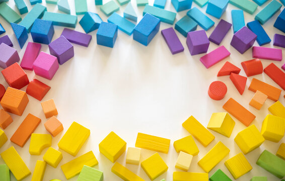 Wooden bricks Montessori material rainbow spectrum row arrangement copy space frame