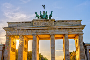 Fototapeta na wymiar The Brandenburg Gate in Berlin with the last sunbeams before sunset