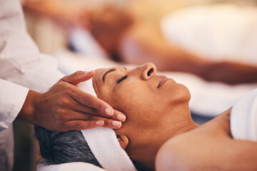 Hands, head and massage with a woman in a spa for wellness or luxury treatment to relax and rest....