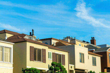 Row of houses in the late afternoon sun in a family neighborhood in San Francisco California