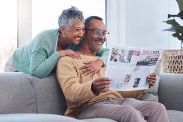 Love, senior couple and reading newspaper, story or news article in living room home. Retirement,...