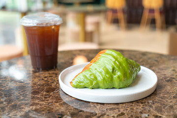 matcha green tea croissant on plate