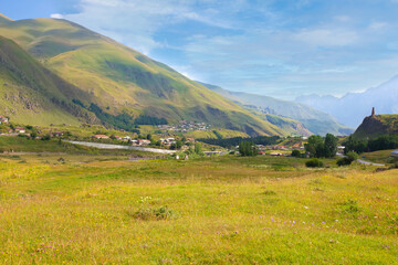 Fototapeta na wymiar Mountain landscape. Beautiful mountains and meadows against the blue sky.