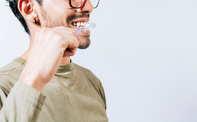 Face of person brushing teeth isolated with copy space. Man brushing his teeth isolated, Face of...