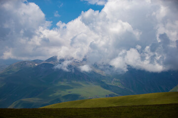 High mountains in low clouds. Mountain landscape. Mountains of Georgia.