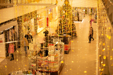 Blurred background New Year's decoration of a large shopping facility, store.