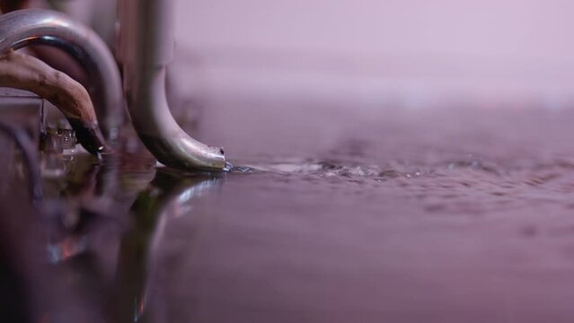 drain water through pipes directly into the pond. 4K videos.