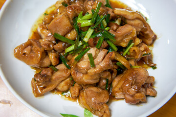 A delicious Chinese home-cooked dish, stir-fried chicken thigh with sauce