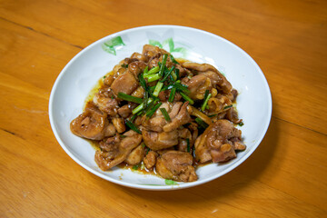 A delicious Chinese home-cooked dish, stir-fried chicken thigh with sauce