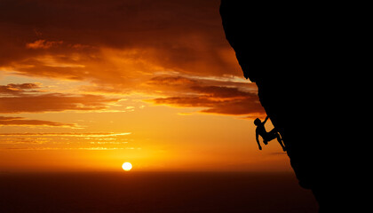 Climbing mountain, sunset silhouette and man sports exercise for fitness, rock training in nature...