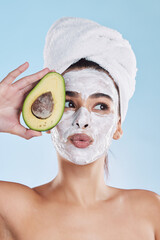 Beauty, skincare and avocado face mask with a beautiful woman taking care of her clean and healthy skin. Organic, fresh and cleansing facial with routine spa treatment with natural ingredients