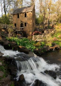 Historical place of Old Mil in Little Rock in Arkansas with flowers and plants near waterfall