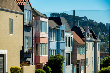 Row of colorful apartment buildings or town homes in San Francisco historic districts in the downtown city or in an urban area