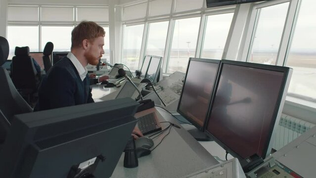 Air Traffic Control officer Working in a Modern Airport Tower. Realtime