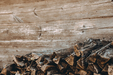 Chopped firewood pile. Woodpile board wall. Wood. Old dry pine wooden heap. Brown color textured...