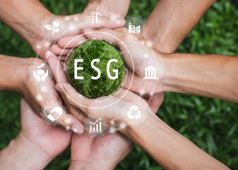 CSR and ESG environmental energy saving collaboration of young children hands stack together on...