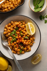 Chickpea dish with curry, cooked chickpeas with spices and herbs. Vegetarian food meal