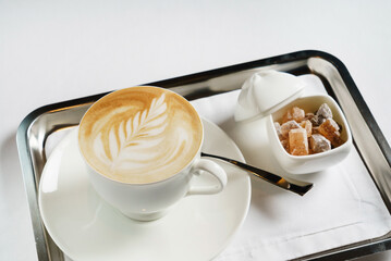 cup of cappuccino with sugar