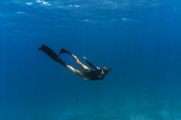 Woman Freediving in ocean in Bahamas