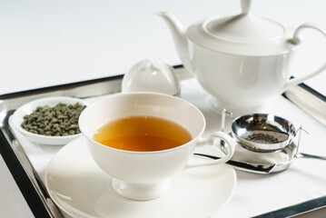Fototapeta na wymiar tea in the teapot on tray