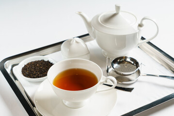 tea in the teapot on tray